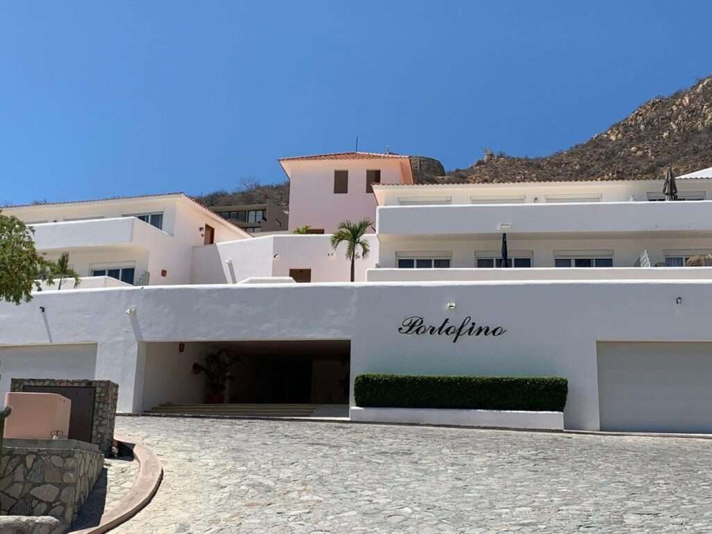 Los Cabos Portofino Discover luxury living in Pedregal's prime, serene community. This stunning 2-bedroom, 2-bath condo offers a proven short-term rental history and a blank canvas for your own exquisite retreat. Virtually staged to showcase its potential, the space feels light, airy, and inviting when furnished.Enjoy a spacious terrace with panoramic city and partial ocean – 91 Camino Bonito Ote, Cabo San Lucas, BS