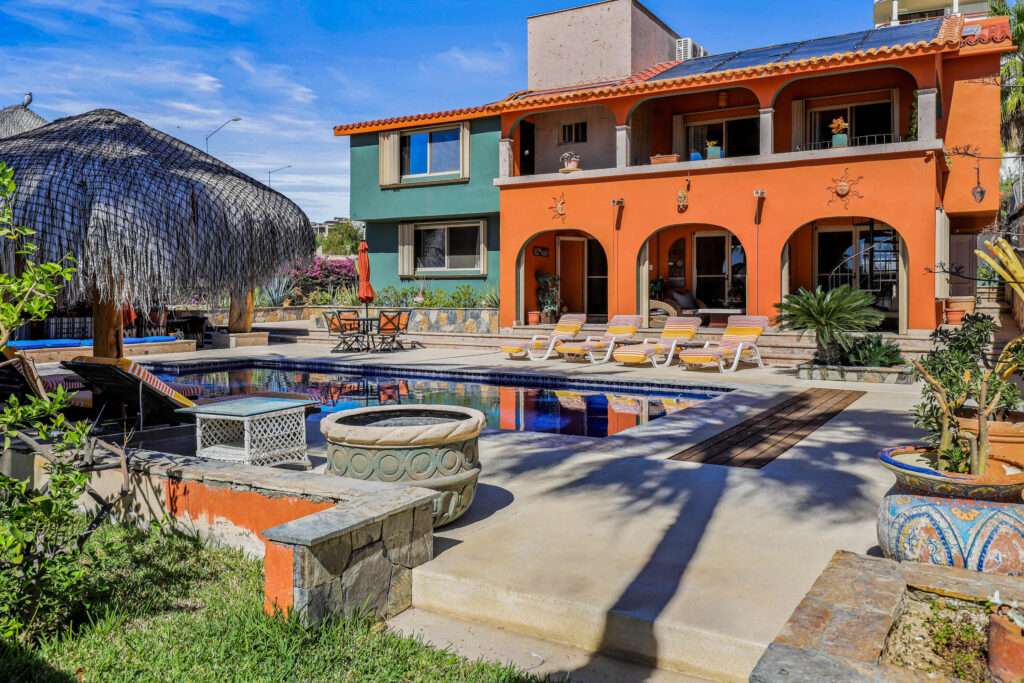 Los Cabos Finisterra STELLAR LOCATION in San Jose´s first residential area, FINISTERRA ST. CASA LULU is an expansive 4BD/4.5BA property on a huge 1000 sq mt/10,807 sq ft. corner lot. ENERGY EFFICIENT with SOLAR PANELS to keep electricity bills extremely low. Completely fenced with a large 2 car Garage & additional space to keep an RV or to store a boat. Spectacular outdoor space with large SOLAR heated SALT WATER swimming pool and PALAPA with BAR & BBQ area. Great opportunity to make this your BAJA home. One Bonus room off the living room is set up for billiards, could also be perfect for an office or media room. Another Bonus space 2rd floor has Laundry Area & Gym. Hurricane Shutters Close to town, the beach, PLC marina & shops. NO HOA dues! OPTION FOR – NO. 56 FINISTERRA ST., San Jose del Cabo, BS