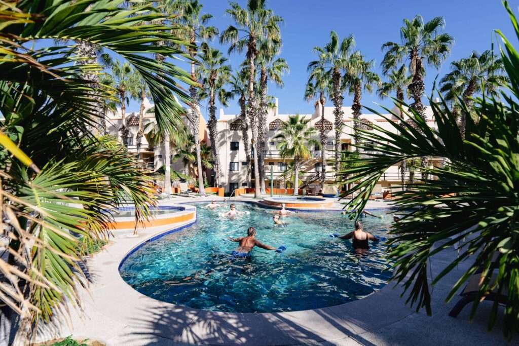 Los Cabos Cora One of the lowest-priced furnished residences currently available in Cora, this 2024-built condo is move-in ready and located within Club Campestre in San José del Cabo. The floor plan offers 3 bedrooms and 3.5 baths with approximately 1,841 sq ft of interior living space. Bright, modern interiors feature large-format tile flooring, an open-concept kitchen with island seating, and expansive sliding glass doors that connect seamlessly to oversized private decks. The interior design emphasizes clean lines, neutral finishes, and a cohesive open layout that connects the kitchen, dining, and living areas into a single, light-filled space. The kitchen is centered around a large island with quartz-style surfaces, modern cabinetry, and pendant lighting, opening directly to the main living area for easy entertaining. Floor-to-ceiling sliding glass doors extend the living space outdoors, creating a strong indoor-outdoor connection and allowing natural light to flow throughout the residence.Living and dining areas are furnished with contemporary pieces scaled appropriately for the space, complementing the modern architectural style seen throughout the development. Bedrooms are well-proportioned and designed for privacy, while bathrooms feature glass-enclosed showers and streamlined finishes consistent with the home's overall aesthetic. Privacy blinds, LED televisions with integrated switching, and thoughtfully placed lighting add functionality while maintaining a clean visual profile.Outdoor living areas are a standout feature, with expansive decks and patios offering generous space for seating, dining, and relaxation while overlooking the community's architectural landscaping and surrounding natural terrain.. Two covered on-property parking spaces include electricity and water connections suitable for electric vehicle charging or vehicle washing, and a private 10x10x14 storage locker with electricity provides secure owner storage.Cora is a gated, master-planned community within Campestre San José, featuring contemporary architecture and resort-style amenities visible throughout the property. Community offerings include a large swimming pool with integrated lounging areas, a hot tub, fitness center, indoor children's play area, and an enclosed dog park, all supported by 24/7 security. The Campestre San José golf course is approximately 0.5 miles away, and the private beach club on the Sea of Cortez is roughly 2.5 miles from the residence, subject to membership terms.Dining, recreation, and services are easily accessible, with Flora Farms approximately 2.8 miles away, Acre Restaurant about 3.0 miles, and the Historic Art District of downtown San José del Cabo roughly 4.5 miles from the property. Beachfront dining along the Tourist Corridor, including venues such as Veleros Beach Club and 7 Seas Grille & Seafood, is approximately 6.5 miles away, while Los Cabos International Airport is about 10.5 miles from the residence.Offered fully furnished and... – phase 3 Rt Punta Palmillas, San Jose del Cabo, BS