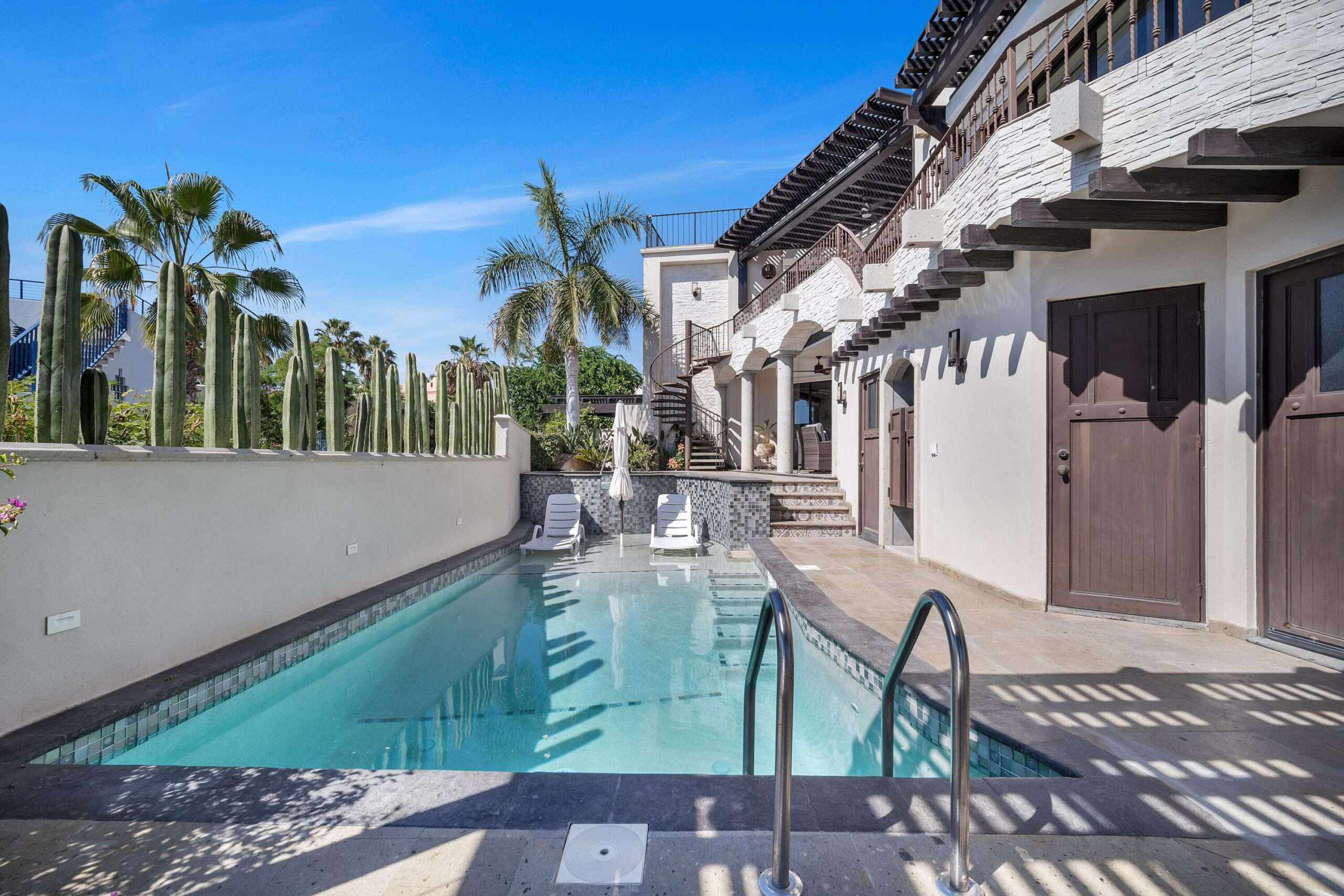 Los Cabos Cabo Bello Impeccable 5 bedroom, 6.5 bath home in Cabo Bello, a gated community in Cabo San Lucas with direct beach access and 24/7 security. Casa Cactus blends modern design with warm Baja style, offering seamless indoor and outdoor living and stunning ocean for sale