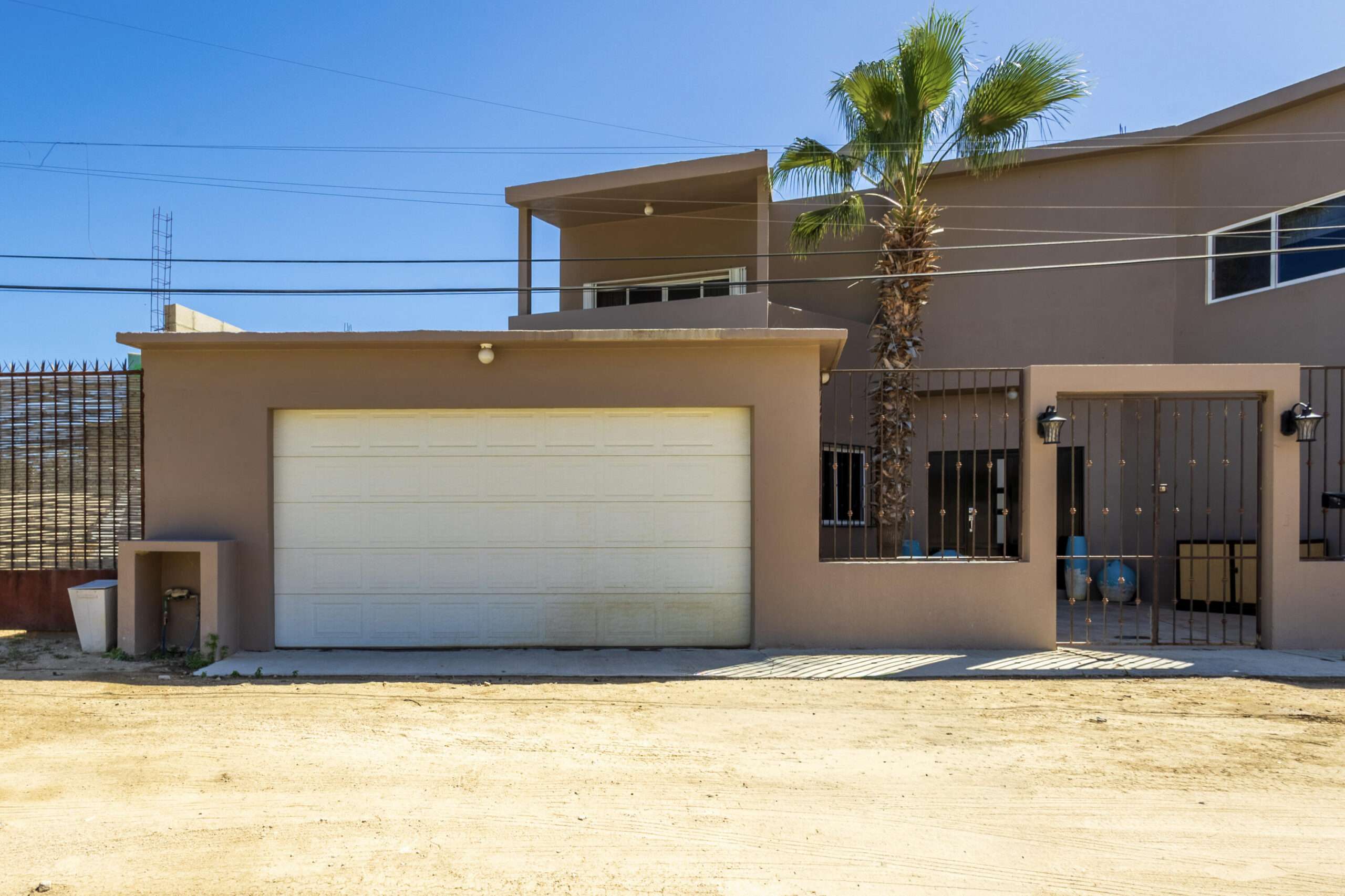 Los Cabos Gringo Hill Located in the original San José del Cabo surfing community of Gringo Hill, this fully gated and walled residence offers exceptional space, privacy, and flexibility for full-time living or a second home close to shopping, restaurants, and merely a 10-minute walk to the surf.''The Surf House'' is set on a generous 500 m² lot (approx. 5,382 sq ft). This two-story home features a substantial construction footprint and a layout designed for real-life living -- ideal for families needing storage for vehicles, surf gear, and all your Baja toys. The main level centers around an open-concept kitchen and dining area that connects seamlessly to the enclosed backyard, where local desert landscaping surrounds a large private pool. A TV room with an ensuite bath on this level provides flexibility as a ground-floor bedroom, guest suite, or workspace.Upstairs, three incredibly spacious bedrooms each include ensuite bathrooms, including a primary suite designed for privacy and comfort that also boasts its own outdoor space. A +500 square foot game room with a built-in bar and powder room adds additional living space ideal for entertaining, media, or family use.Two separate two-car garages flank the home -- a rare feature that offers extensive parking, storage, or future conversion potential.The home is offered unfurnished and presents an excellent opportunity for buyers to personalize finishes and modernize to their taste while benefiting from the impressive scale, structure, and unique layout already in place.With no HOA dues in Gringo Hill, coupled with a convenient central location, The Surf House stands out as a versatile home for buyers seeking size, privacy, and long-term opportunity. for sale