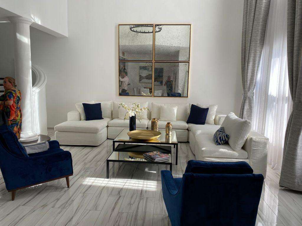 Los Cabos Villas De Oro Phase 1 Villa de Oro fantastic. Number 304 is very unique as it is one of a few town homes (most are upper or lower)that has a massive dramatic two story window that lights up the home. Downstairs has the impressive living and dining room. The kitchen has a new granite counter, a breakfast area and a bar for guests to enjoy the activity in the kitchen. Outside living with a big space to dine and sit around the large stone fireplace. Upstairs there are two bedroom suites, one of which has an outside terrace to enjoy the ocean – Villas de Oro, San Jose Corridor, BS