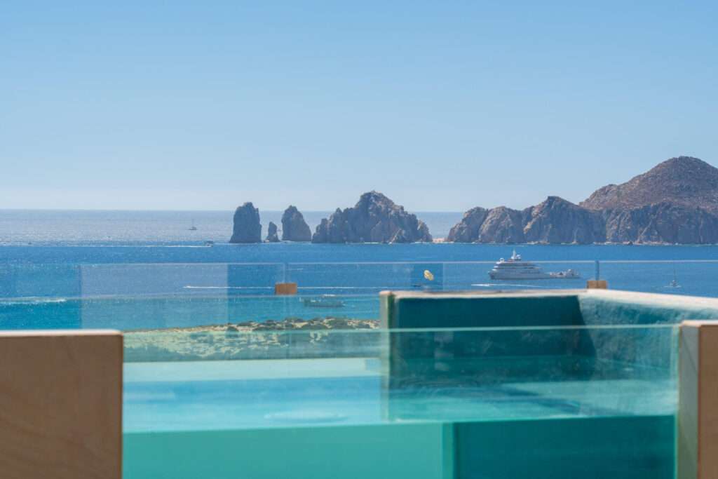 Los Cabos Breeze Of Cabo Discover this modern 2-bedroom, 2-bathroom condo located in the highly sought-after Sunset area of Cabo San Lucas. This corner unit offers maximum privacy with only one neighbor and features spacious windows and a cozy terrace where you can enjoy breathtaking sunrises and sunsets. The property includes underground parking, access to a shared rooftop with a swimming pool and panoramic ocean – Vista Vela II The Penthouse, Cabo Corridor, Cabo Corridor, BS